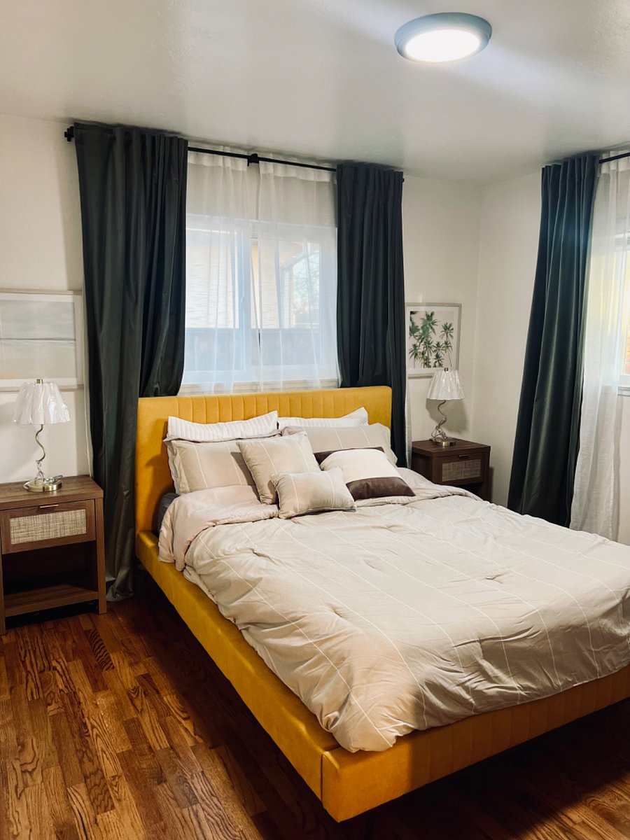 Extremely comfortable cocoon bed and blackout curtains + sheer curtains