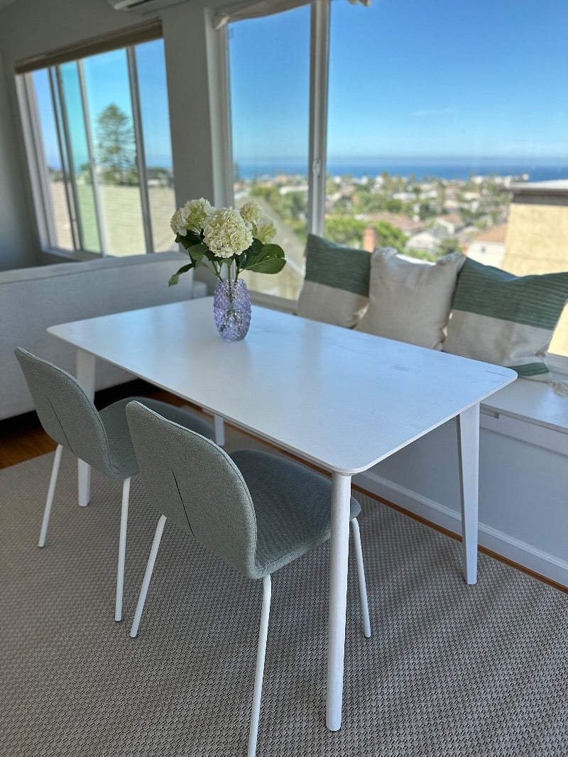Comfortable dining area with ocean views. Bench seating contains lift top entry for storage.