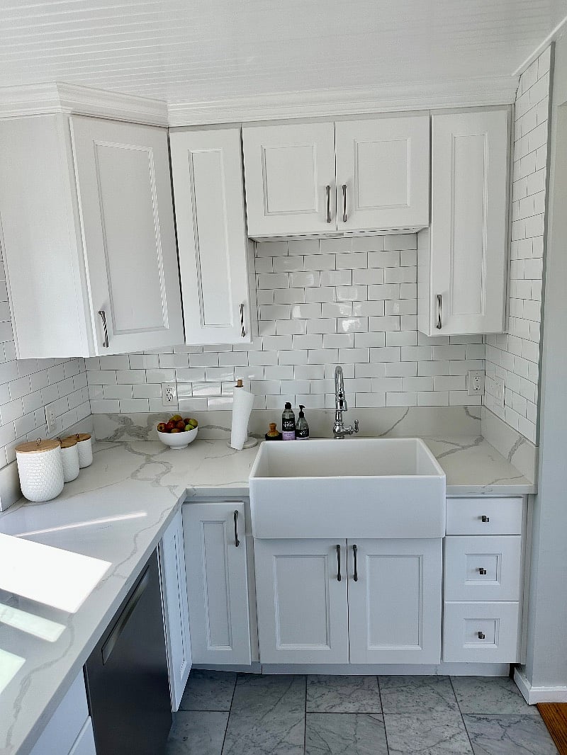 Large farm sink with specialty pull down faucet.