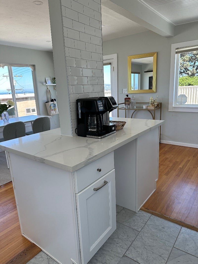 Kitchen island with coffee station, pull out trash/recycle and storage.