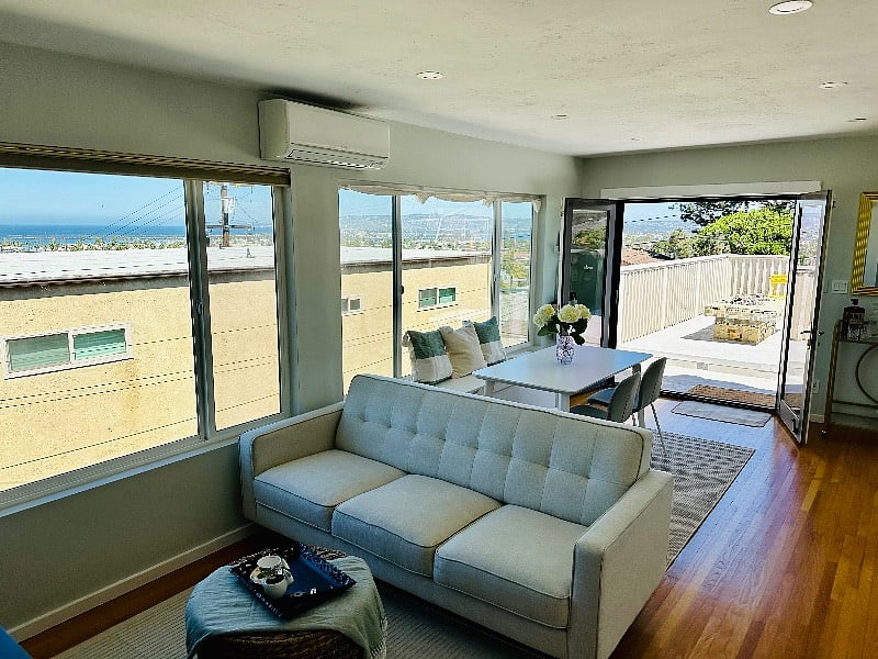 View looking from the living room and dining room towards the deck
