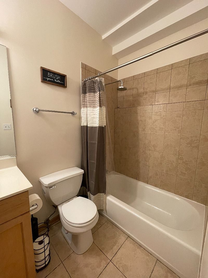 View of Bathtub and Shower Head in Ensuite Bathroom
