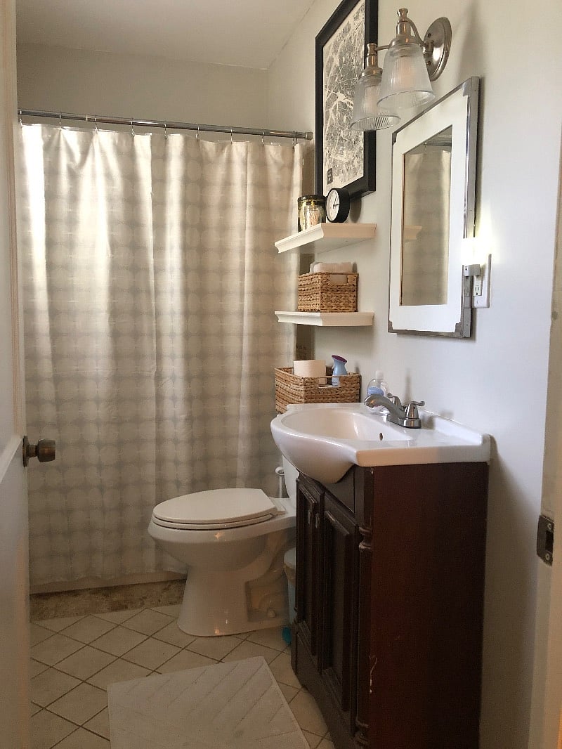 Shared bathroom with tub/shower combo and storage piece for your bathroom essentials 