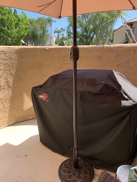 Grill located on side patio