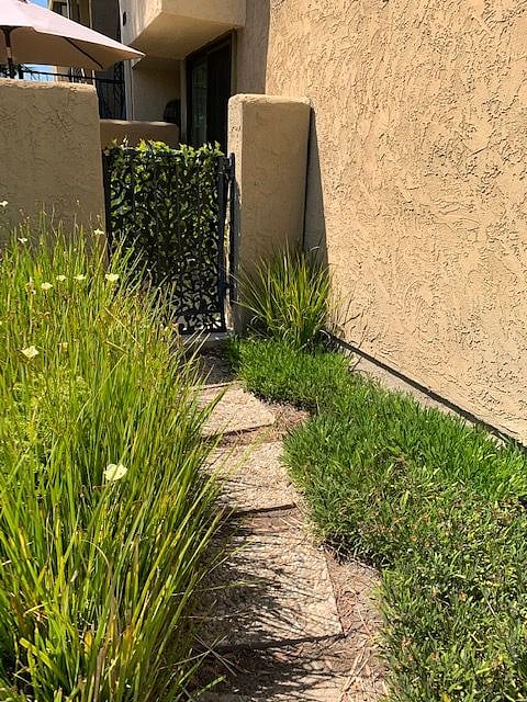 View of walkway to side patio