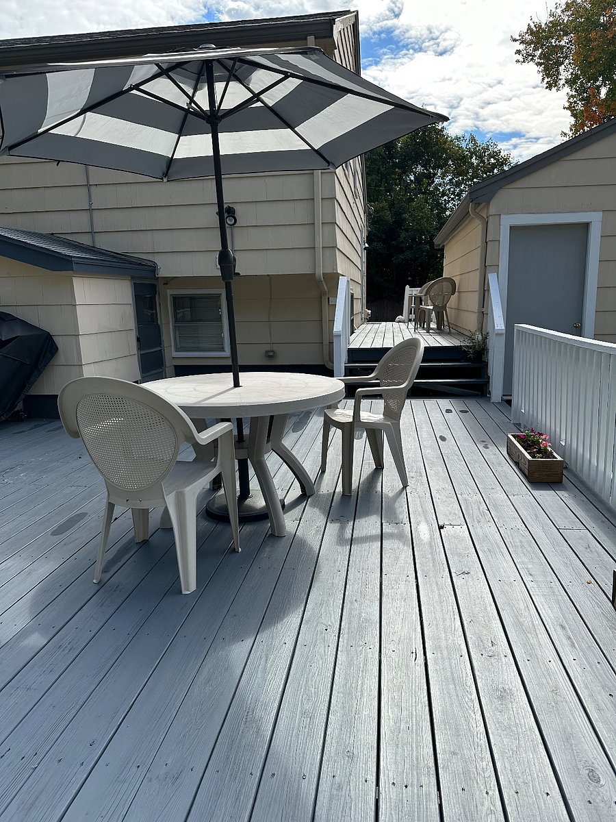 Private rear entrance to the unit, shared backyard deck 