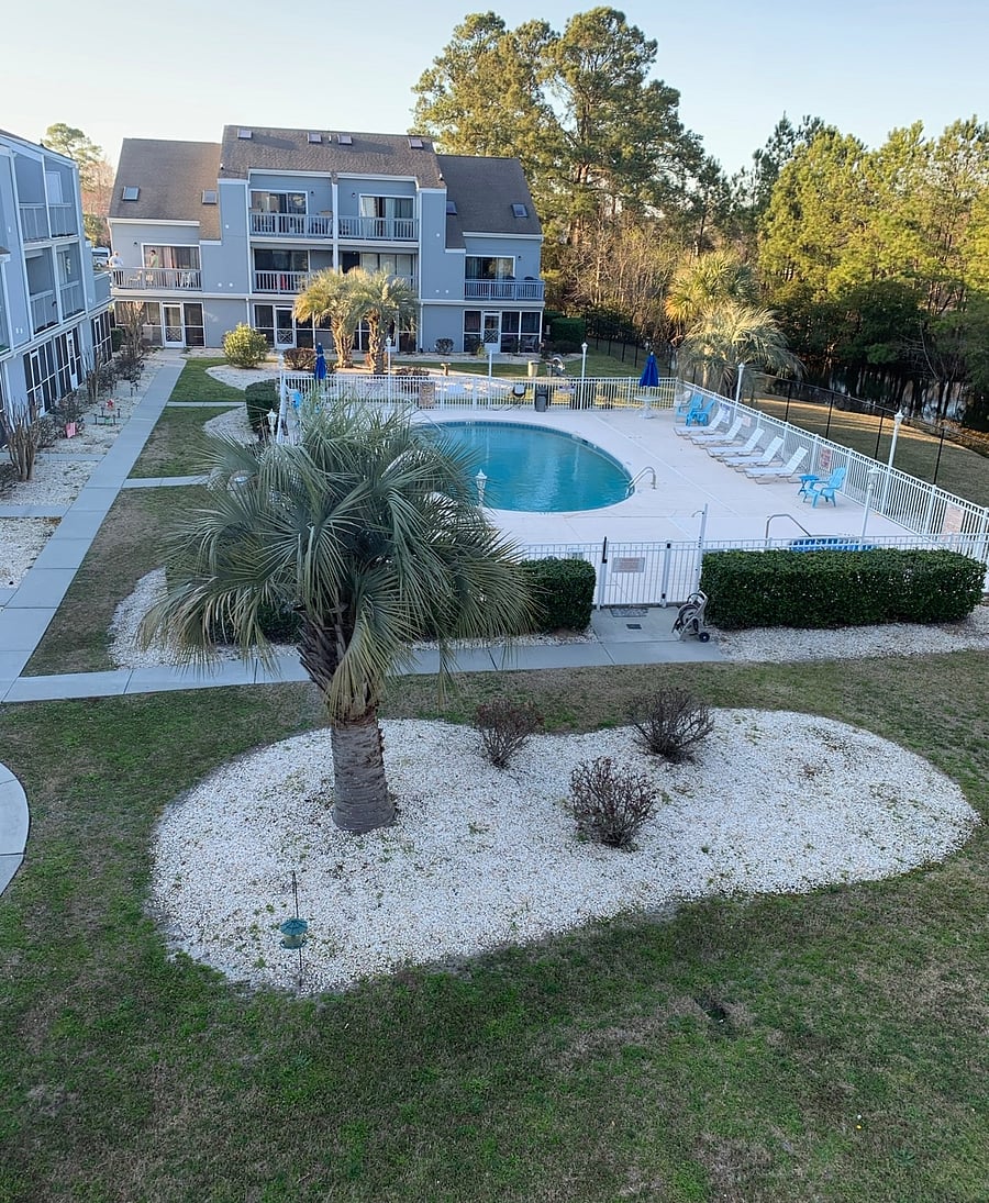 Just relaxing poolside . View from the balcony  hot tub next to the pool