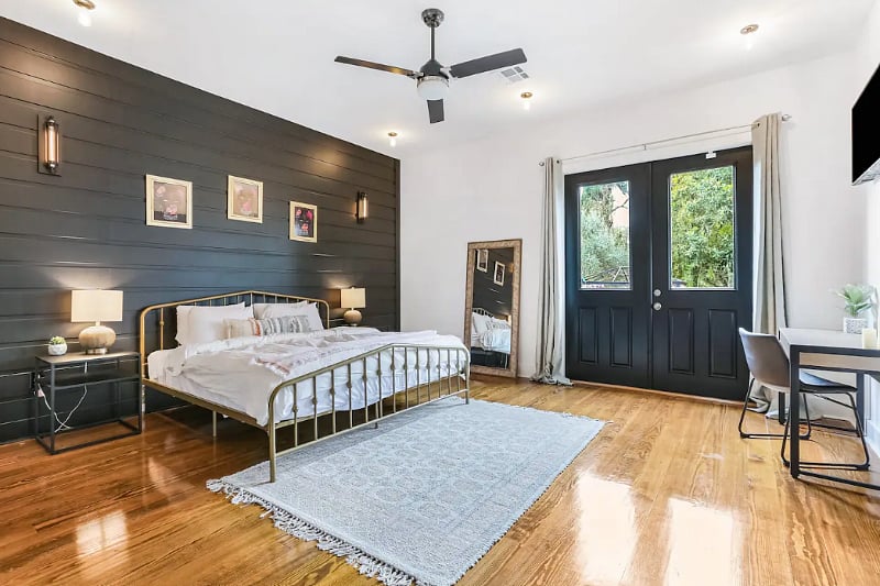 Large master bedroom with work desk .