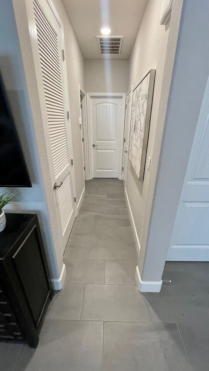 Hallway to bedroom and bathroom