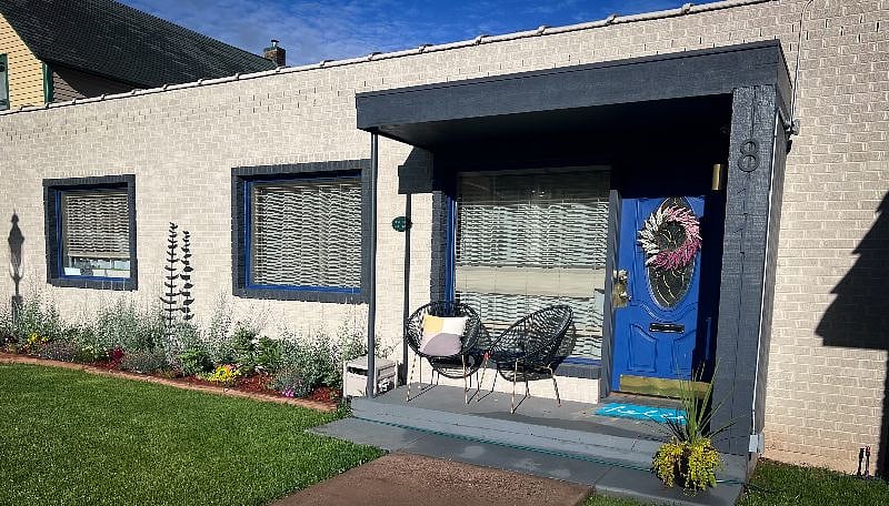 Fenced front yard with porch