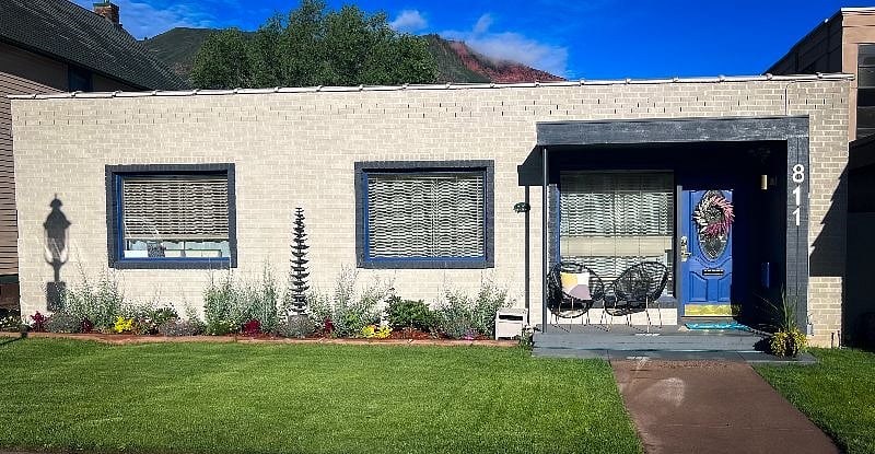 Fenced front yard with porch