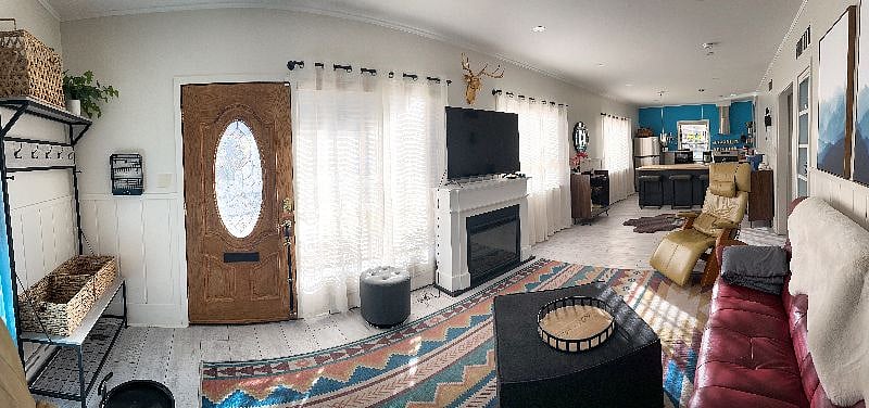 Sunny, spacious living room and open concept kitchen