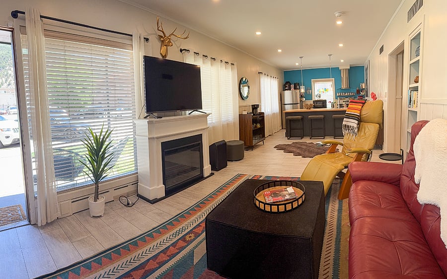 Sunny, spacious living room and open concept kitchen