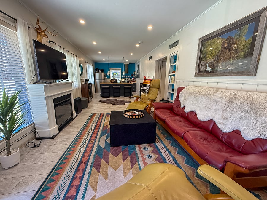 Sunny, spacious living room and open concept kitchen