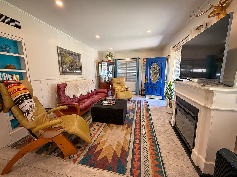 Sunny, spacious living room with fireplace