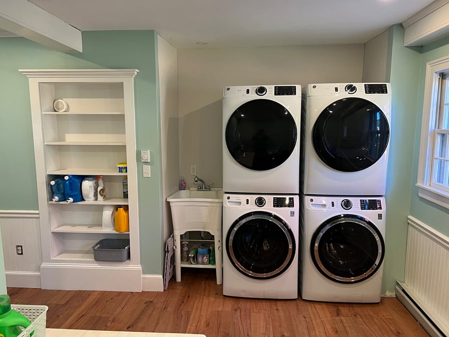 Our laundry room has two extra-capacity washer/dryers and a laundry sink