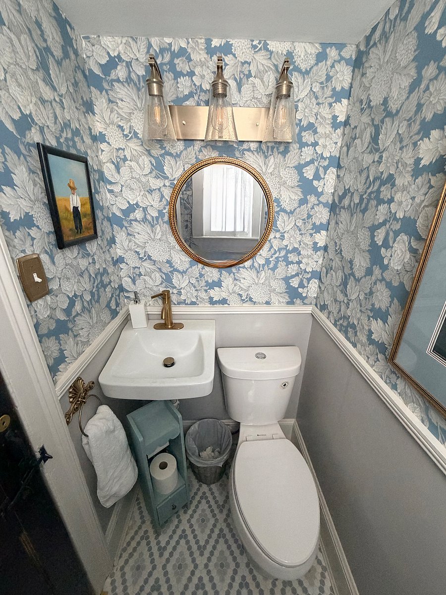 An extra half bath located under the hallway stairs.