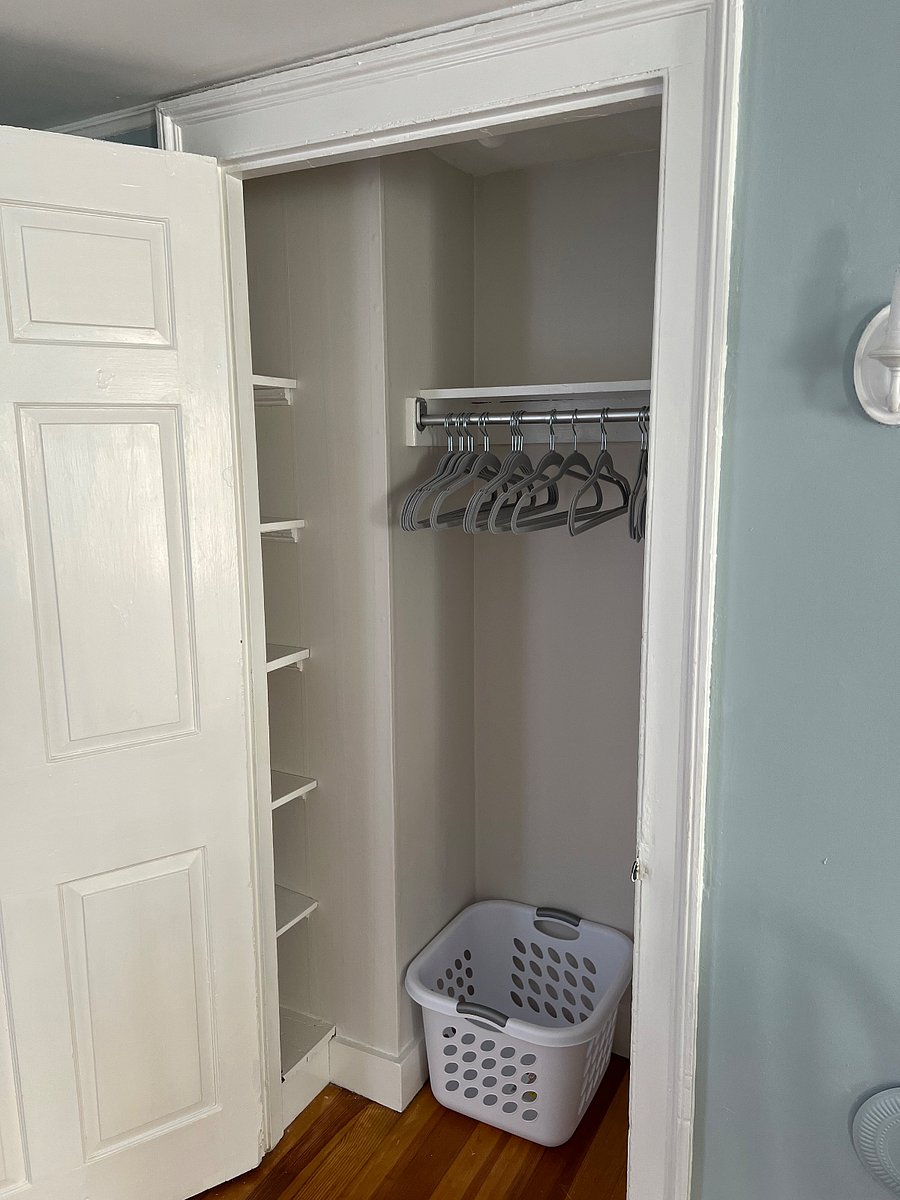 Your room has a rather large closet with lots of shelving both in the room and in the closet.