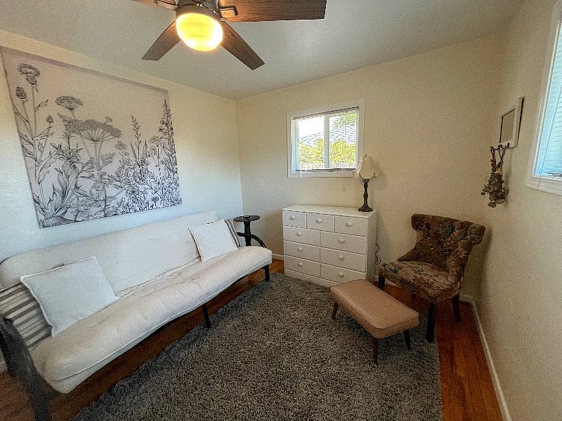 Futon that can easily turn into a bed or use the room as a cozy office.