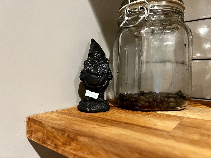 Greg the gnome oversees life at the apartment.