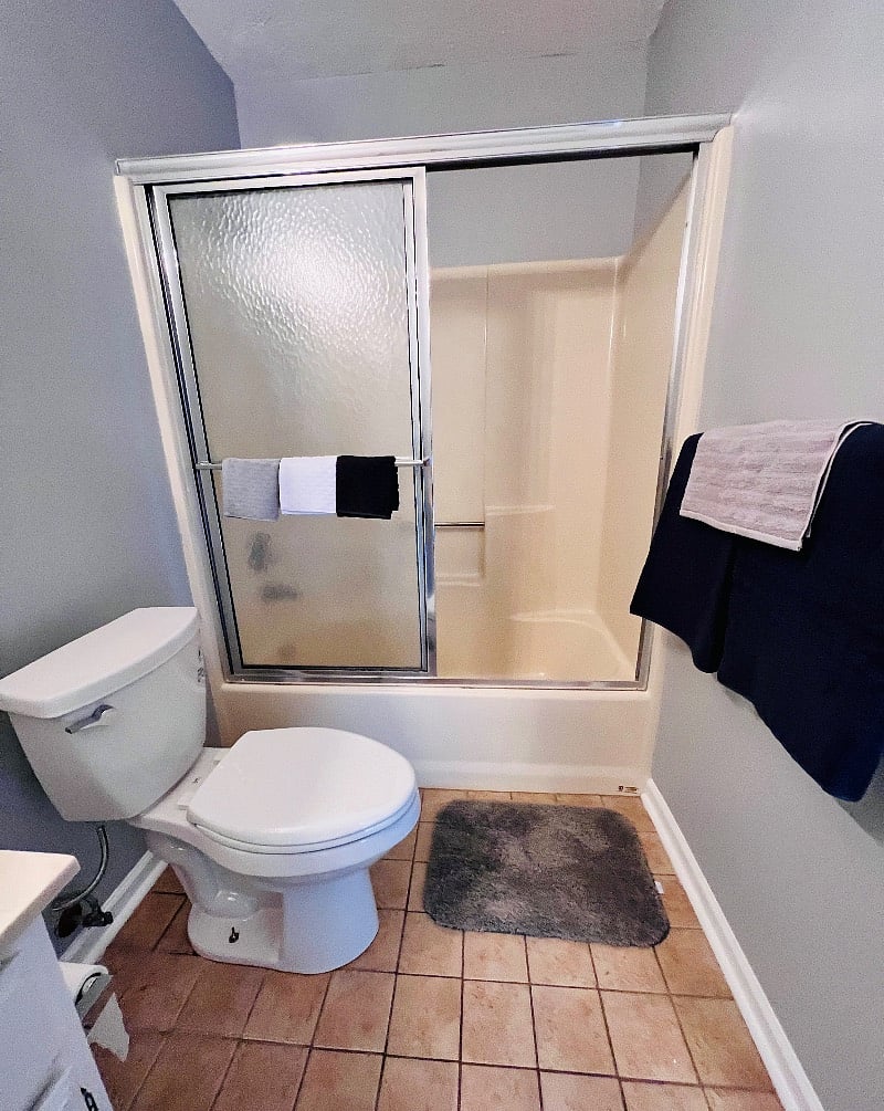 bathroom paired with front room, located just outside of entry into front room