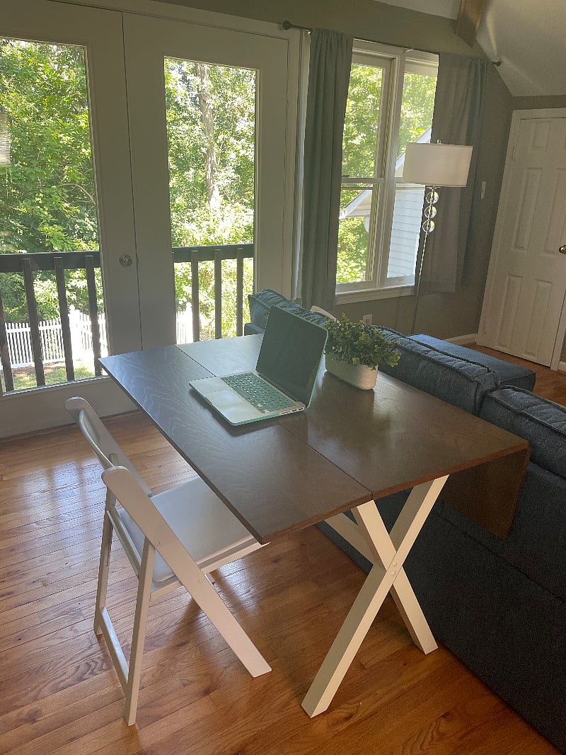 Expandable table behind the couch can also be used as a desk.
