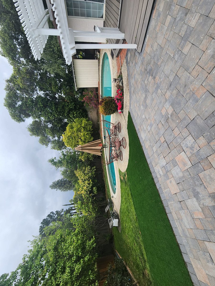 Backyard with pavers and swimming pool