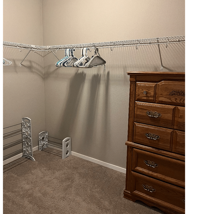 Primary Bedroom Walk in closet with dresser