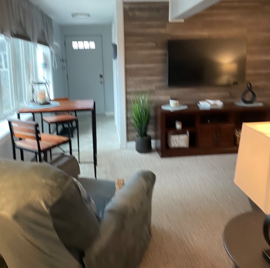 Bistro eating area.
Large casement windows.
55in Smart TV.
Entrance in background.
