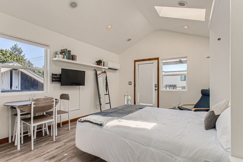 Main living/sleeping area with murphy bed down.
