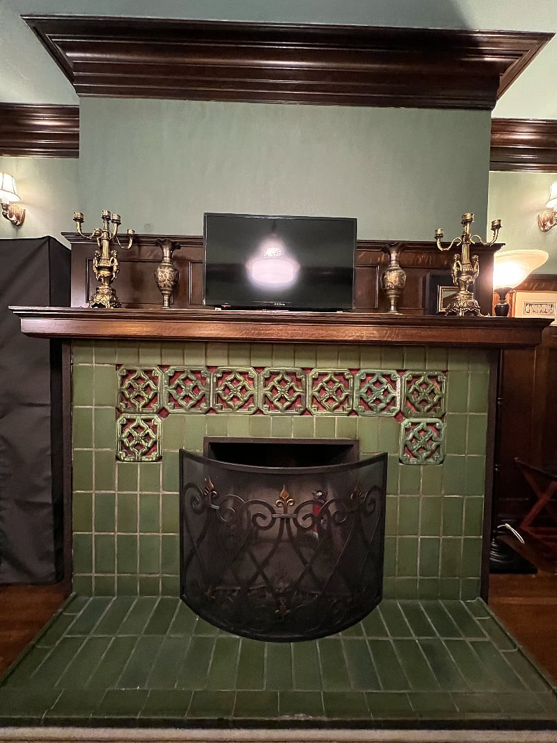 Charming fire place in walnut paneled room