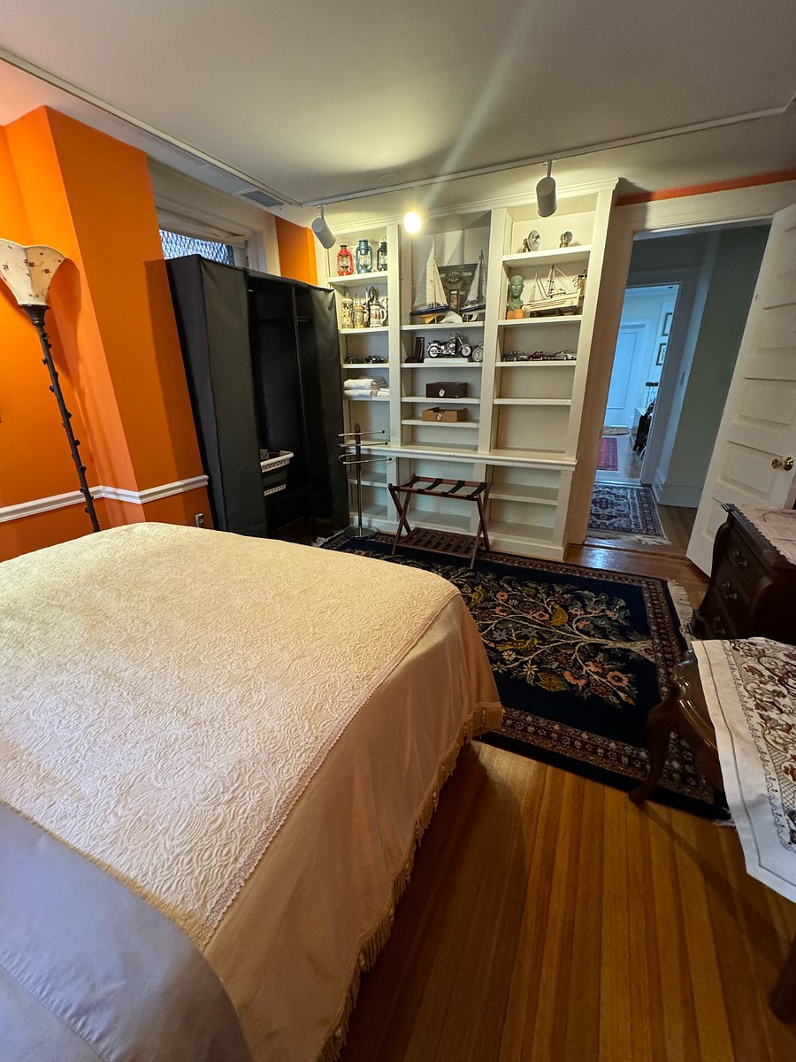 We offer other private rooms with private bath within the main row house when the wooden paneled room is rented. This is one of the bedrooms and you have access to the main house, roof top, and kitchen. 