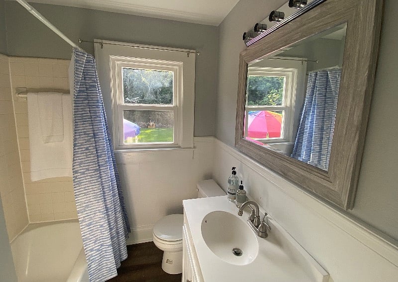 Full Bath with tub/shower combination. Vanity storage. Linen closet just outside bathroom door. 
