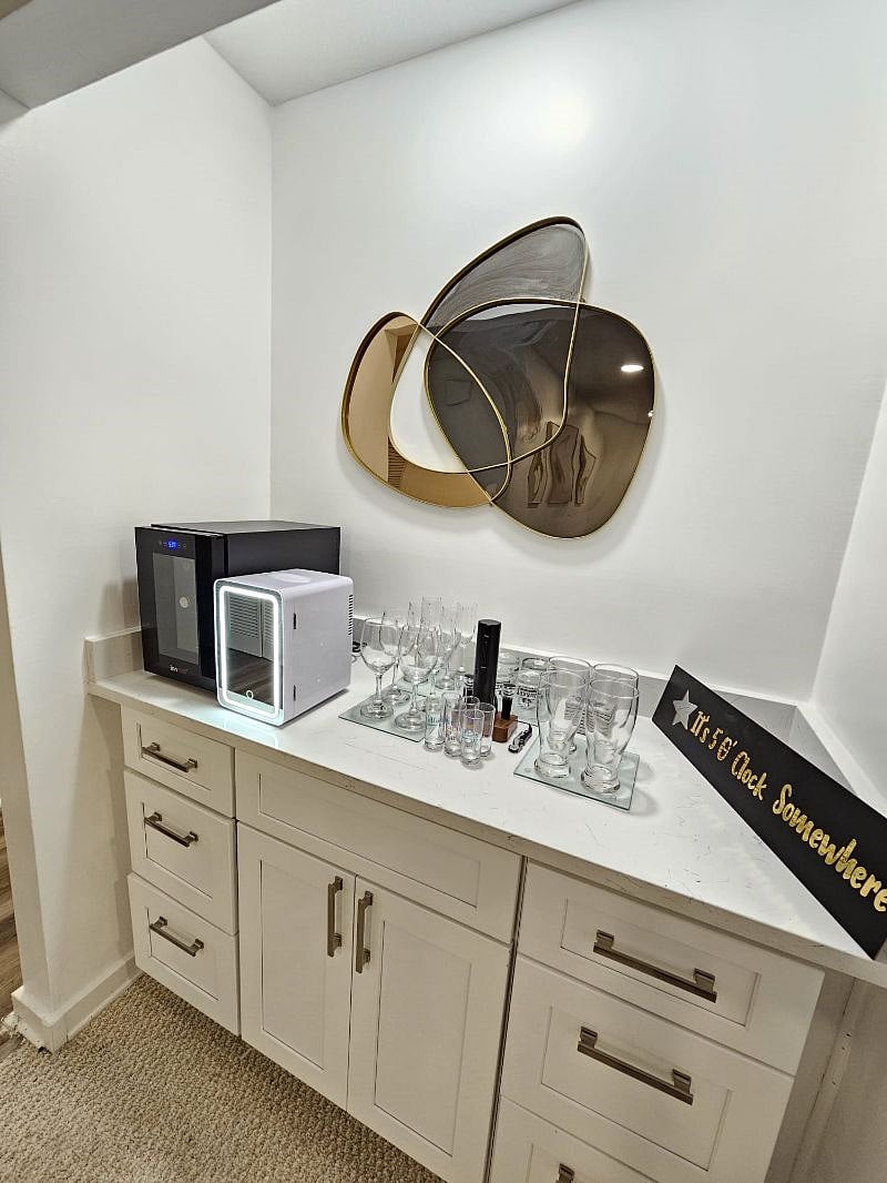 Mini bar with Wine cooler, Mini refrigerator, Wine opener etc. 