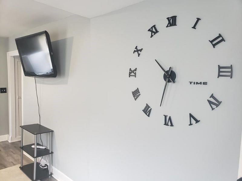 Wall Clock and 40" Wall Mounted TV