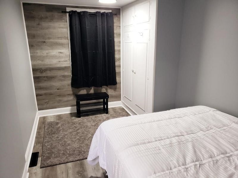 Master Bedroom with Sitting Bench and Black out Curtains
