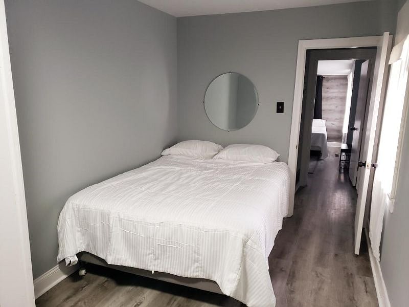 Master Bedroom with Queen Sized Bed and Built in Closet/Cabinets