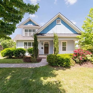 Cape Cod with large fenced back yard and covered front porch!