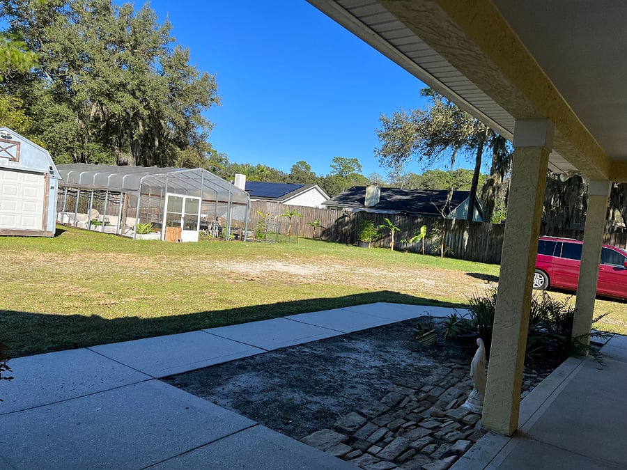 view of the vegetable garden from porch