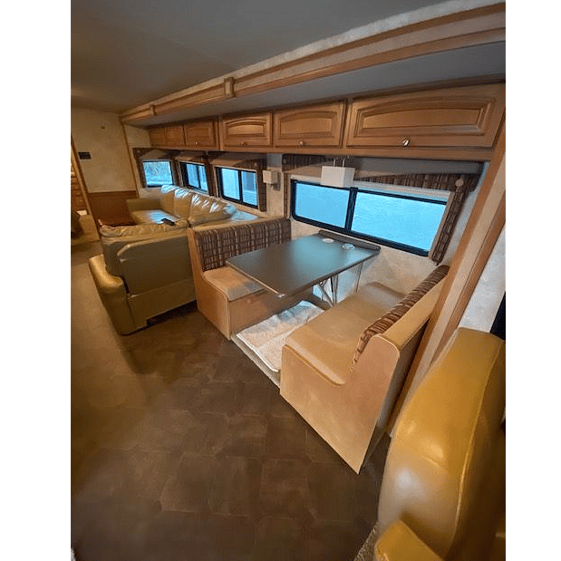Dining table/work station. Storage cabinets above.