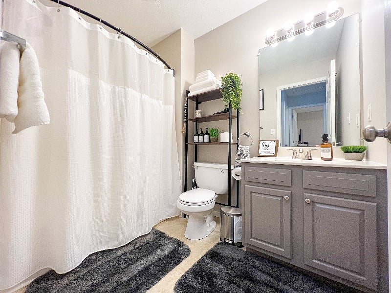 Full bathroom upstairs near both bedrooms. Wide, curved shower bar for increased shower space. Wait until you feel the extremely soft bath rugs!