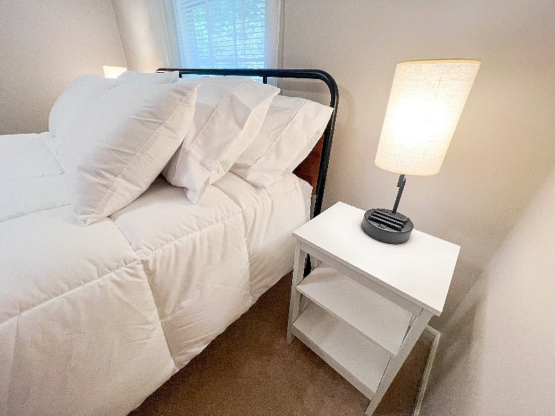 Nightstands with shelves & nightlights (with built in charging stations) are on each side of the bed