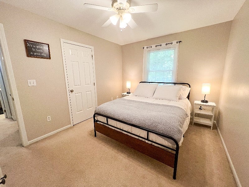 Bedroom 1 has a super comfy queen mattress with extremely soft sheets, comforter, & throw blanket for the best sleep! (not pictured: black out curtains!)