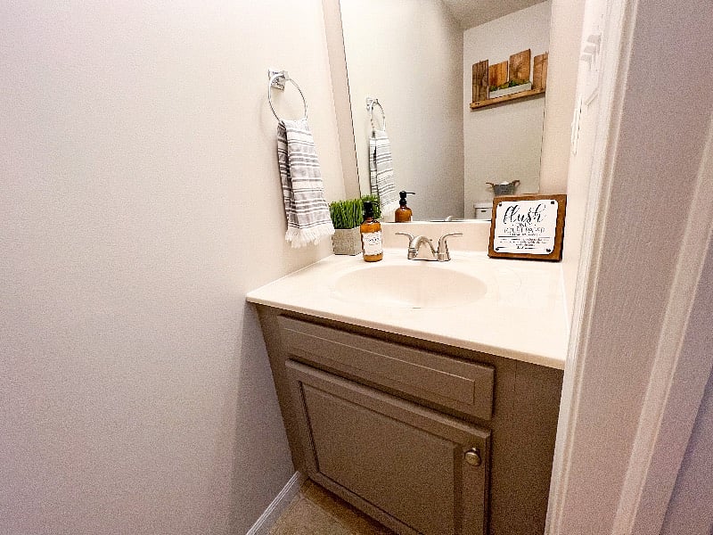 Half bathroom located near kitchen and living room