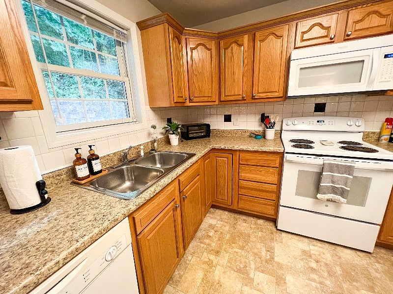 Window above the sink looks out to the backyard & patio!