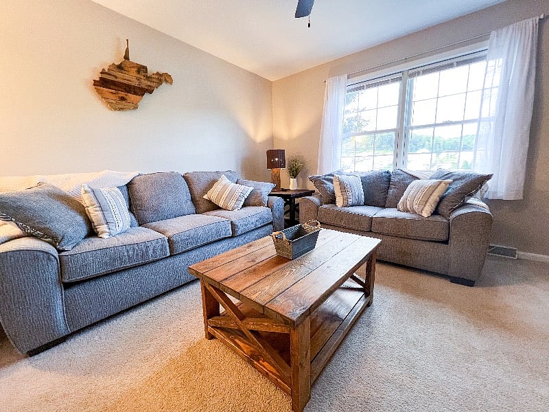 There are large windows looking out at the front of the property.