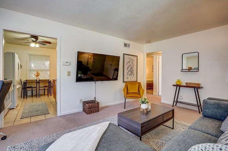 Living area. Kitchen is to the left and bedrooms and bathroom are straight ahead, through the hallway.