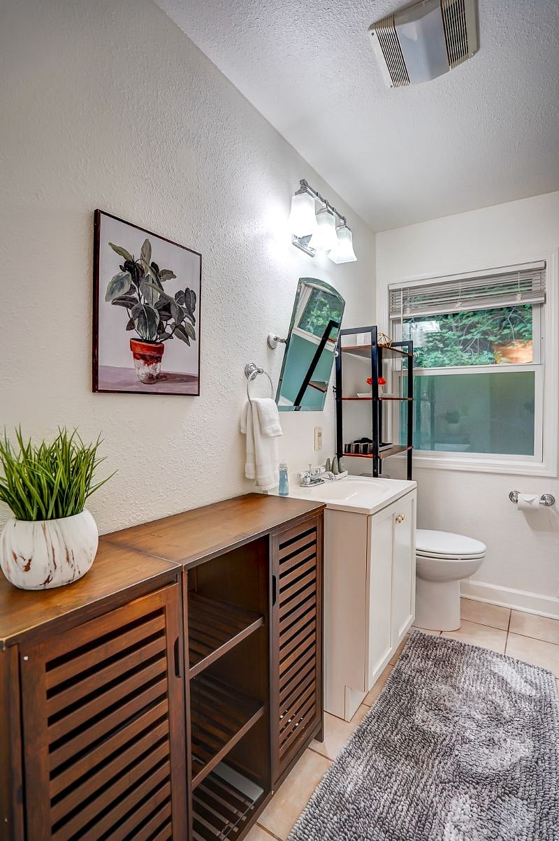 Bathroom with shelving for extra storage!