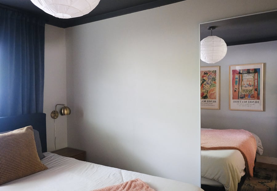 Primary - king bed, closet (divided by wall into two closet sections on the left and right), black out curtains, full length mirror