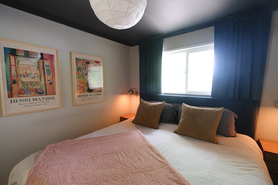 Primary - king bed, black out curtains, closet, full length mirror, front house facing